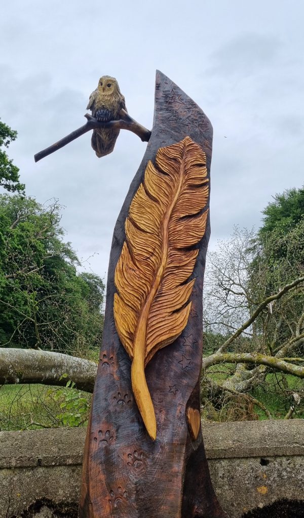 Feather and owl wood carving